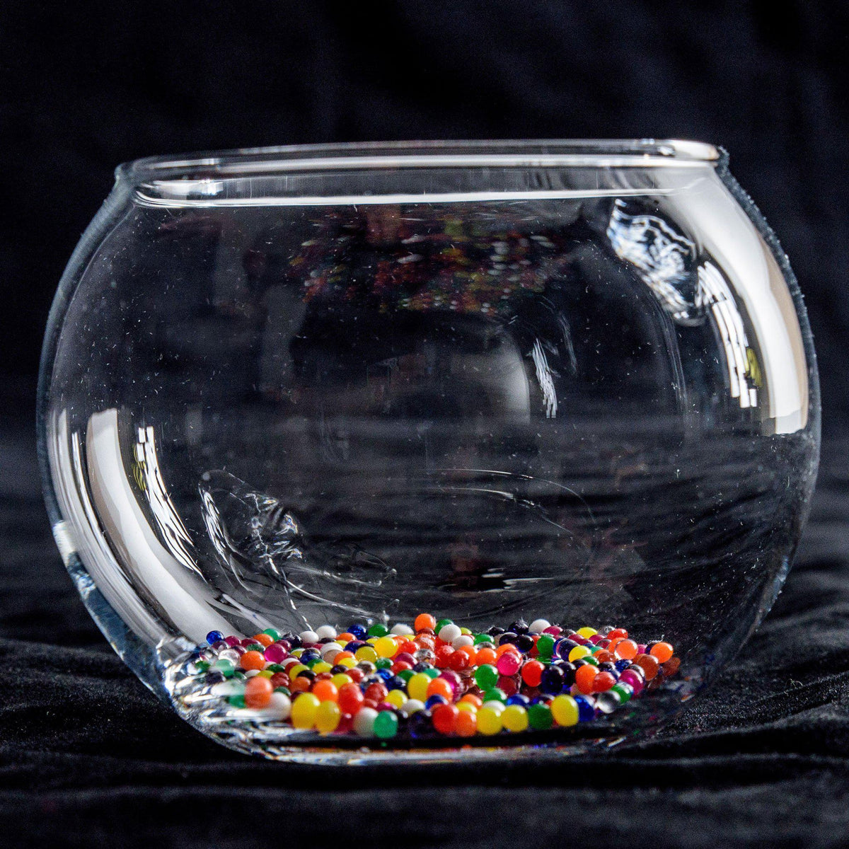 Front view of a bowl full of water marbles.