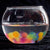 Front view of a bowl full of water with expanded water marbles at the bottom.