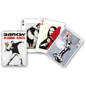 Front view of Banksy Playing Cards in its box and various cards beside it.