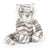 Front view of bashful snow tiger sitting against a white background.