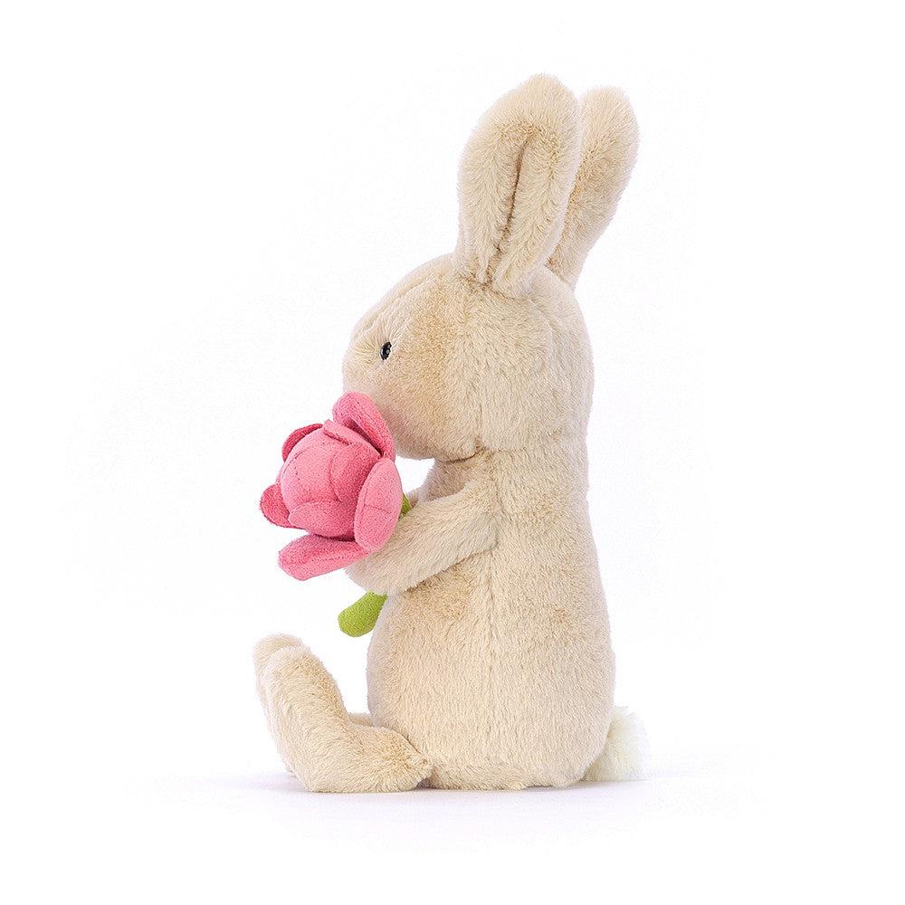 Front side view of Bonnie Bunny With Peony showing bunny holding the flower.