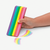 Front view of hand holding and erasing with Jumbo Rainbow Fruit Scented Eraser