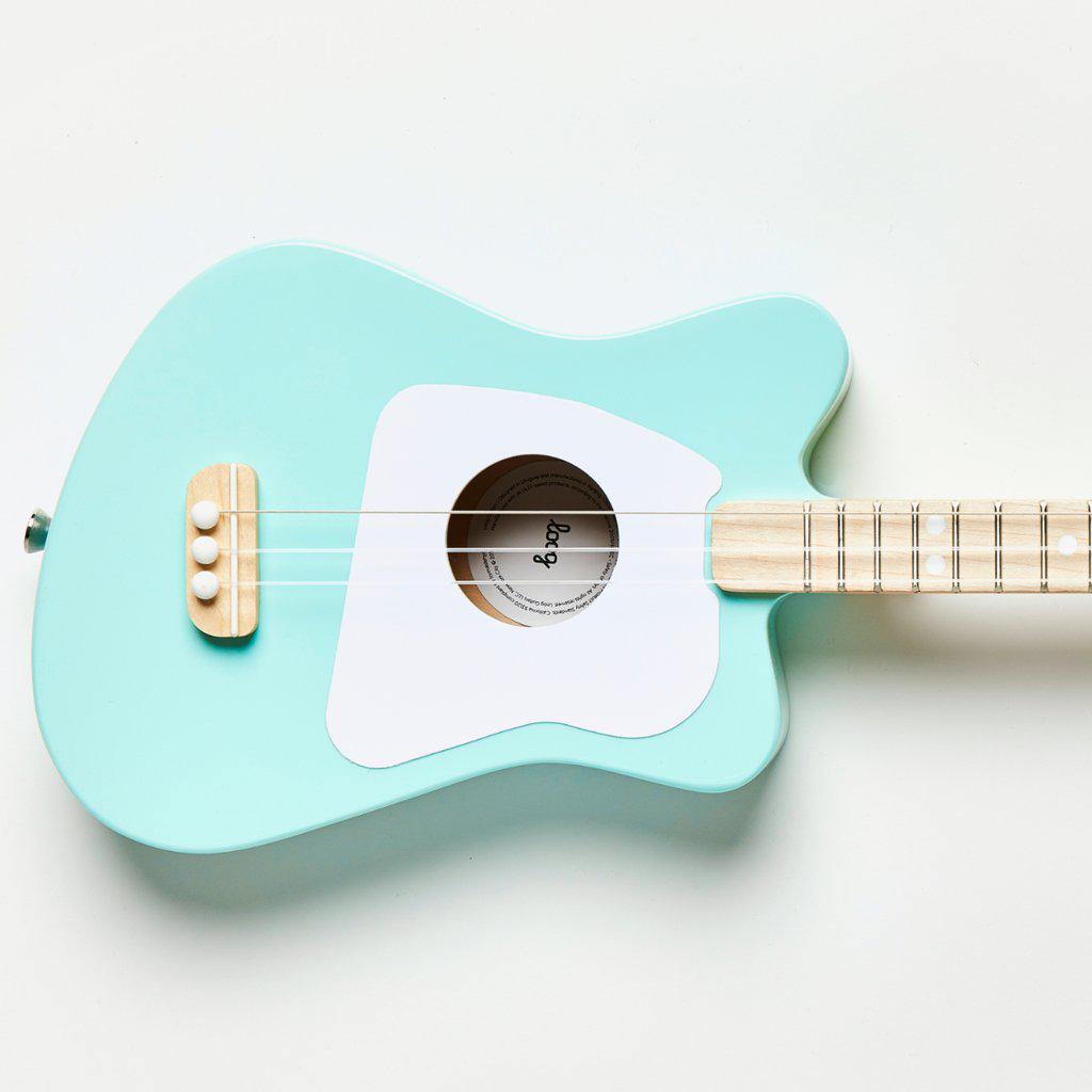 Front view of a section of the mini green guitar.