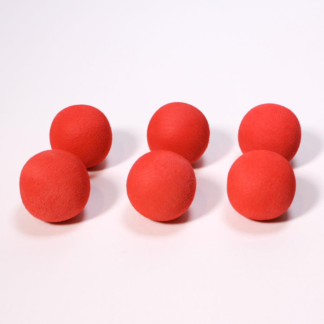 Front view of red mischief maker refill balls in box.