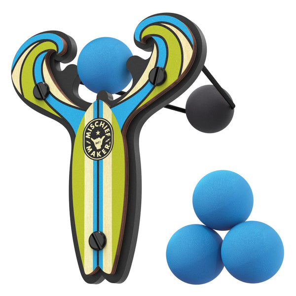 Front view of blue mischief maker slingshot with three blue refill balls stacked beside it.