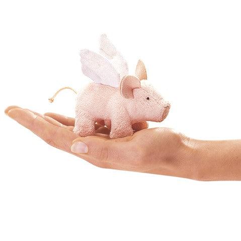 Mini flying piglet on hand. 