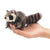 Mini raccoon finger puppet on hand. 