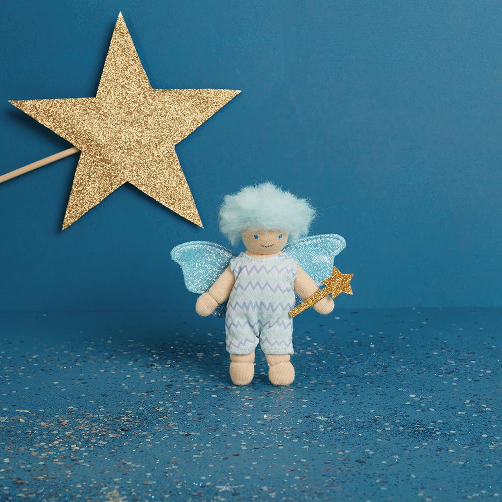 Front view of Willow The Worry Fairy holding his wand on a blue background with a big gold star.