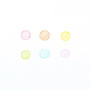Front view of a white paper showing the colors from Rainbow Scoops erasable crayons drawn in a circle to show what they look like when used.