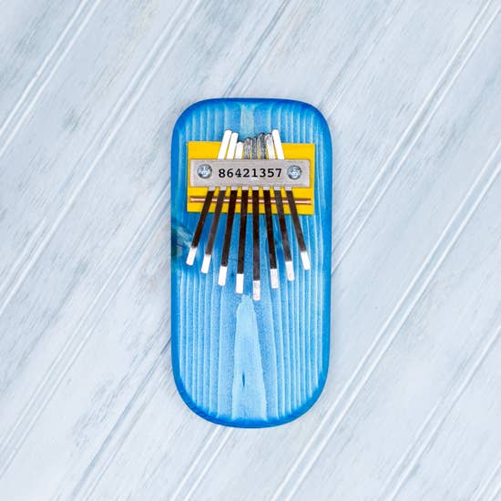 Front view of blue Pine Kalimba thumb piano.