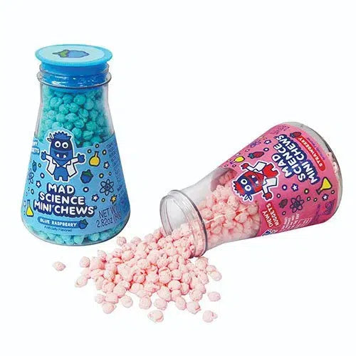 Front view of Mad Science candy in beakers featuring blue raspberry standing up and strawberry turned on it's side with strawberry nuggets spilling out to the bottle.