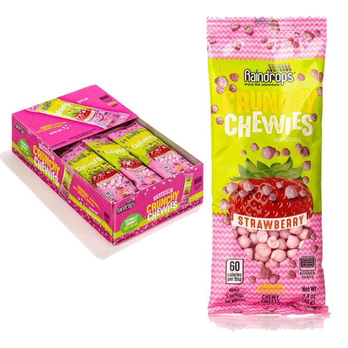Front view of a close-up of a pack of strawberry chewies, with the case of strawberry chewies in the background.