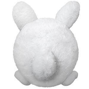 Rear view of fluffy bunny showing his tail.