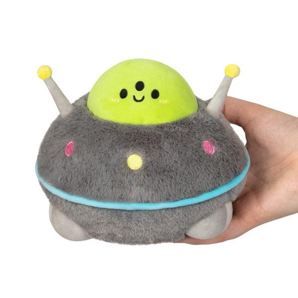 Front view of hand holding snacker UFO.