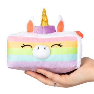 Front view of Snacker Unicorn Cake in a person's hand.