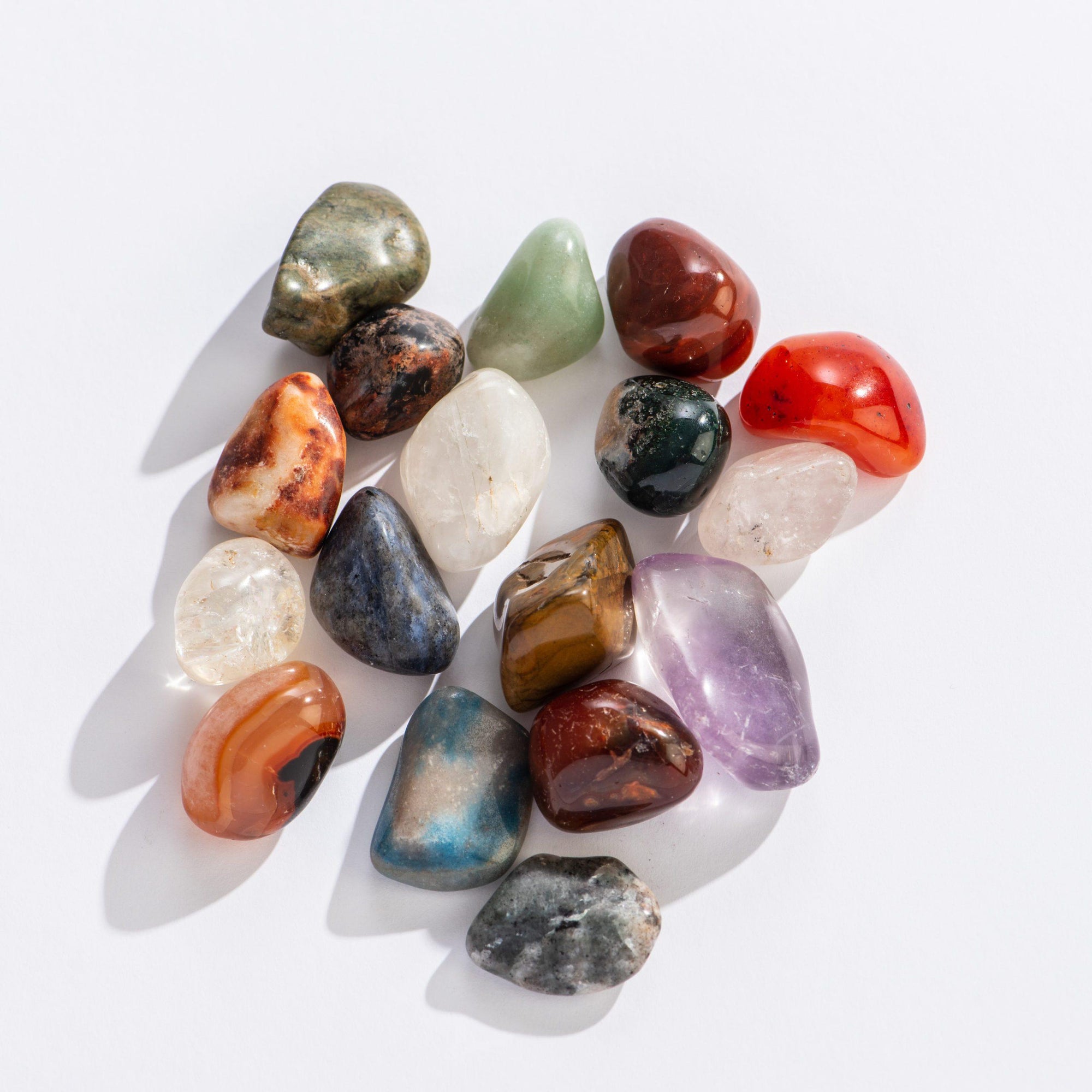 Front view of a variety of rocks from the Fill-A-Pouch-Rock Treasure Bag.