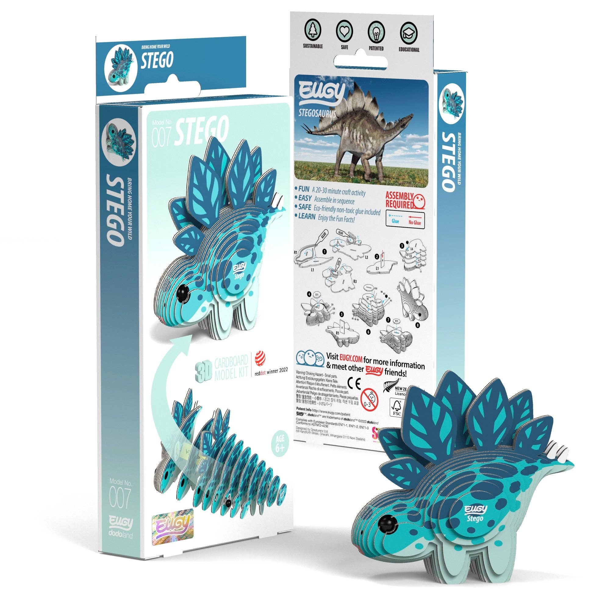 Two packages of the Stego puzzle next to each other, one box is displaying the front of the packaging. The other box is displaying the back of the packaging. A finished model is sitting infront of the two boxes.