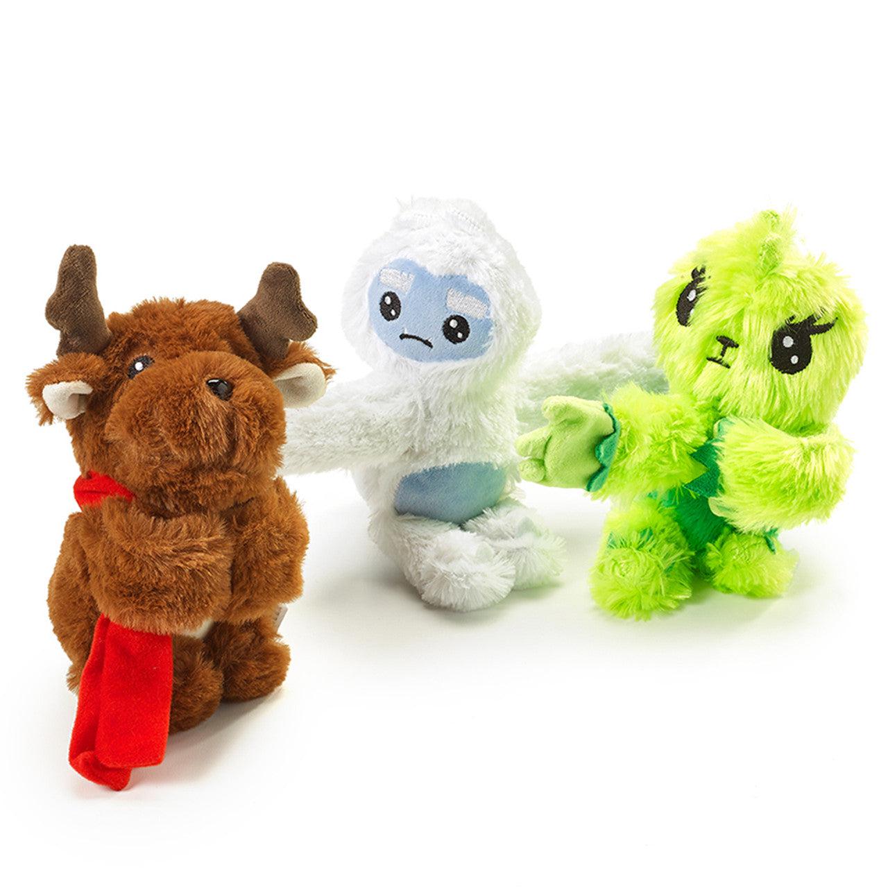 Slap bracelets designed to look like either a raindeer (brown and red), a yeti (white and blue), and the grinch (bright green)