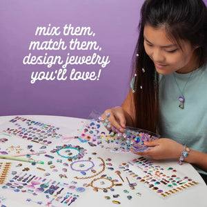 Front view of a girl making charms with the charmtopia set.
