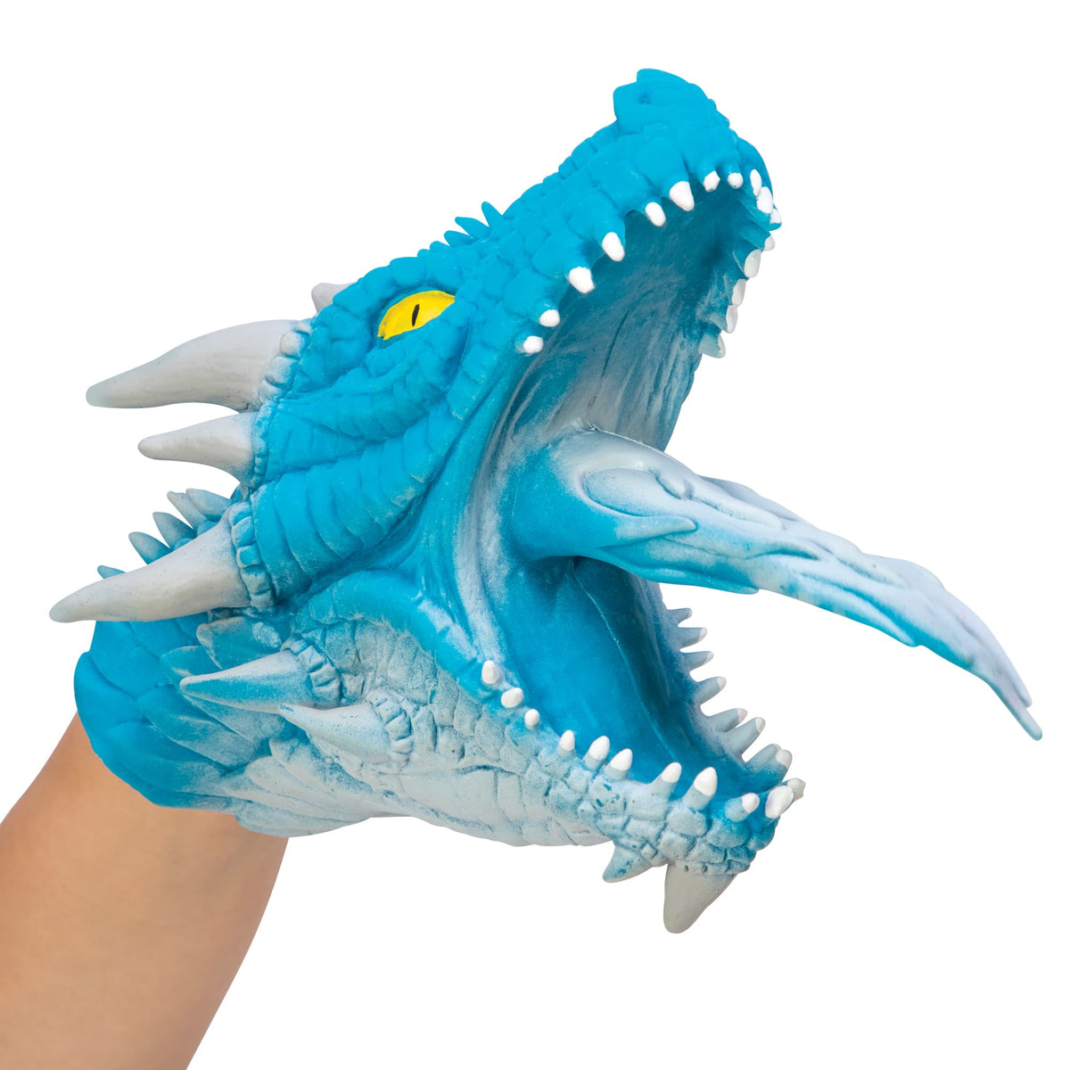 Side view of a blue dragon hand puppet on a hand.