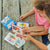 Front view of an adult and child playing with What Do I Do? Conversation Cards.