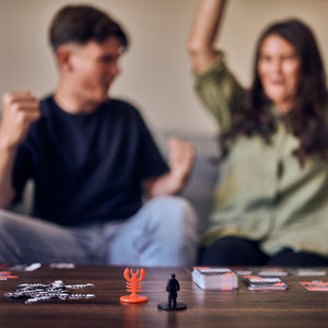 Front view of 2 people playing lobster mobster.