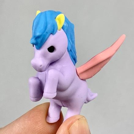 Front view of the lavender pegasus with the blue mane and pink wings being held from the Puzzle Eraser-Unicorn &amp; Pegasus.
