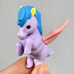 Front view of the lavender pegasus with the blue mane and pink wings being held from the Puzzle Eraser-Unicorn & Pegasus.