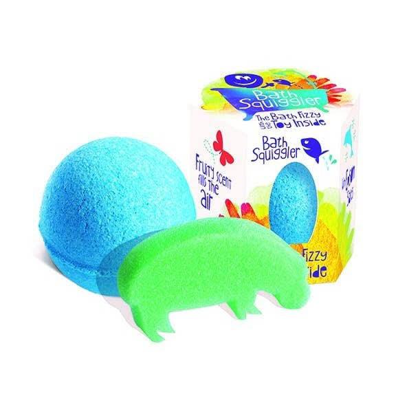Front view of the turquoise Bath Squiggler-Single Bath Bomb Surprise sitting beside with the package and the surprise beside it.