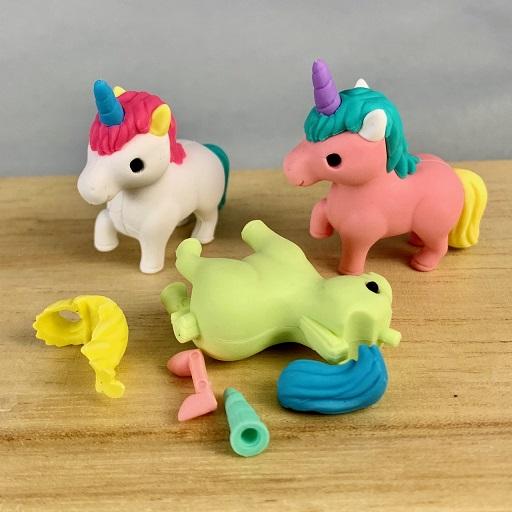 Front view of the white and pink unicorn from the Puzzle Eraser-Unicorn &amp; Pegasus with the green one in front broken apart to be put together.