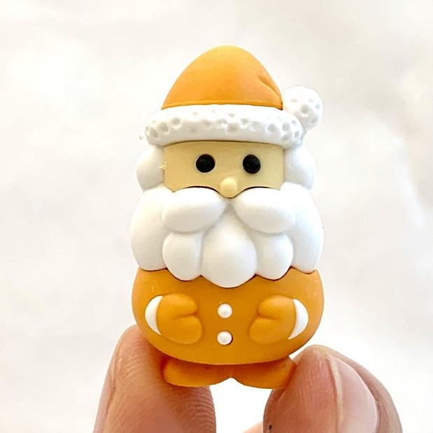 Front view of the yellow santa from the Puzzle Eraser-Multi-Colored Santa Claus.