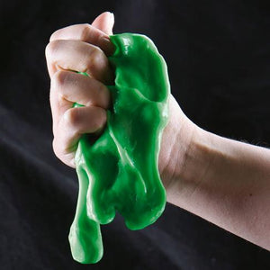 Front view of a hand squeezing the viscoelastic slime.