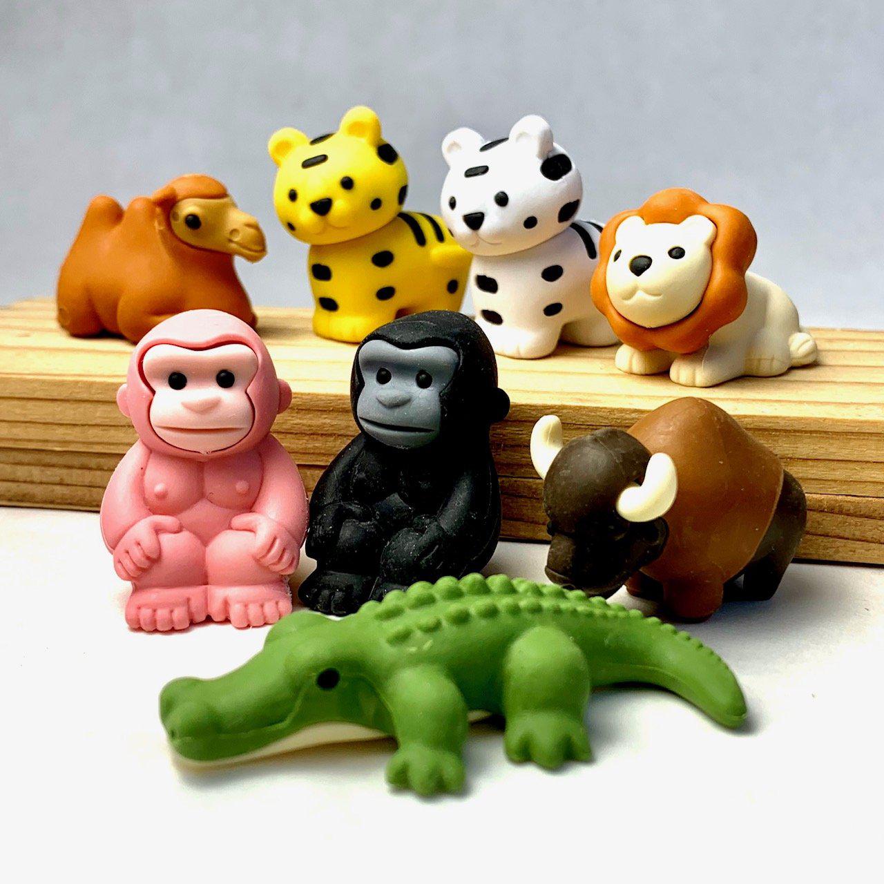 Front view of a variety of Puzzle Eraser-Safari including an alligator, bison, pink and black gorillas, lion, camel, and yellow and white tigers.