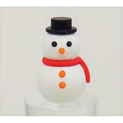 Front view of all the colors of the Puzzle Eraser-Snowman including red, pink, orange, green, blue, and purple against a Christmas background with two Christmas trees.