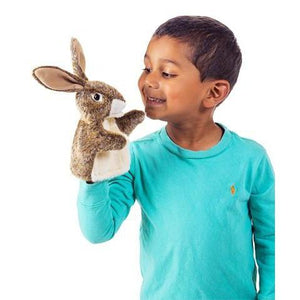 Little hare puppet for little hands in a conversation with a boy in an aqua blue shirt