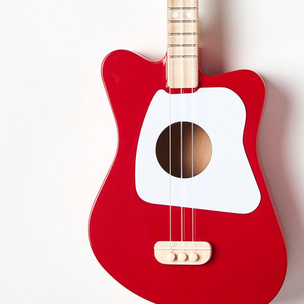 Front view of a section of the mini red guitar.