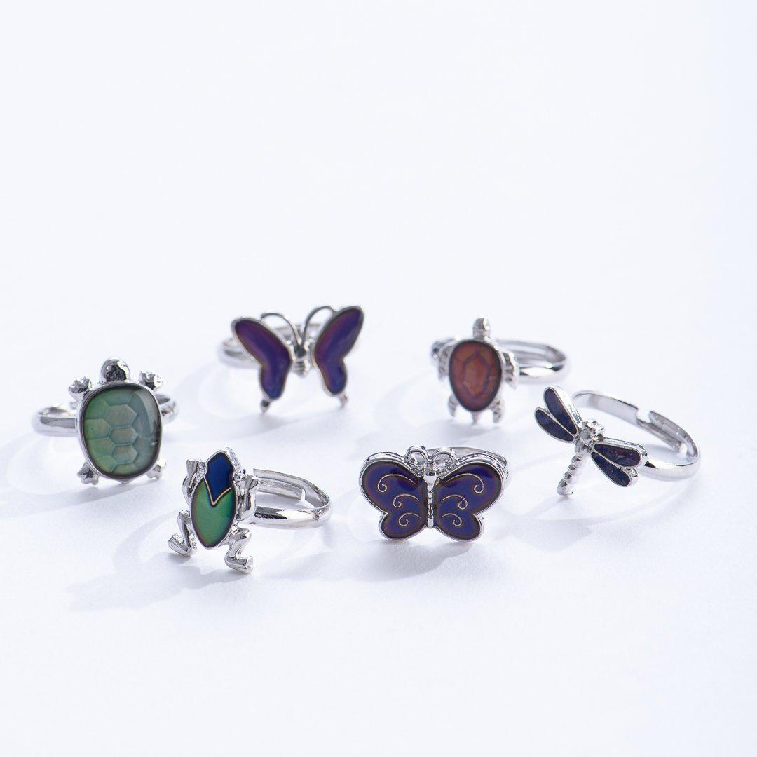 Front view of the various Outdoor Creature Mood Rings including the turtles, butterflies, dragonfly, and frog.