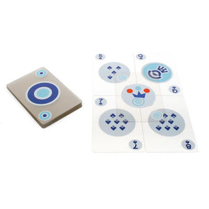 Deck of blue transparent cards laid out face up. Back side has blue circles and front side shoes playing card number and suit