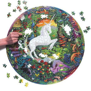 Puzzle in the process of being assembled, with a white unicorn rearing up in the center of a colorful garden with animals