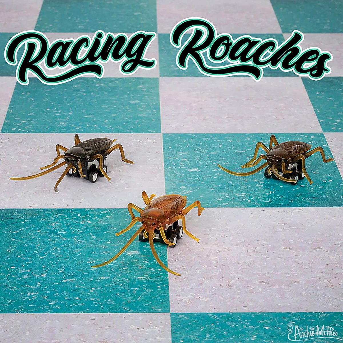 Front view of three Racing Roaches on a turquoise and white checked floor racing.