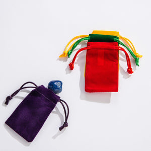 Front view of a variety of different colored bags including purple, red, green, and yellow from the Fill-A-Pouch-Rock Treasure Bag.
