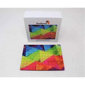 Finished puzzle with Puzzle box with partially assembled puzzle featuring translucent, rainbow-colored, overlapping triangles.